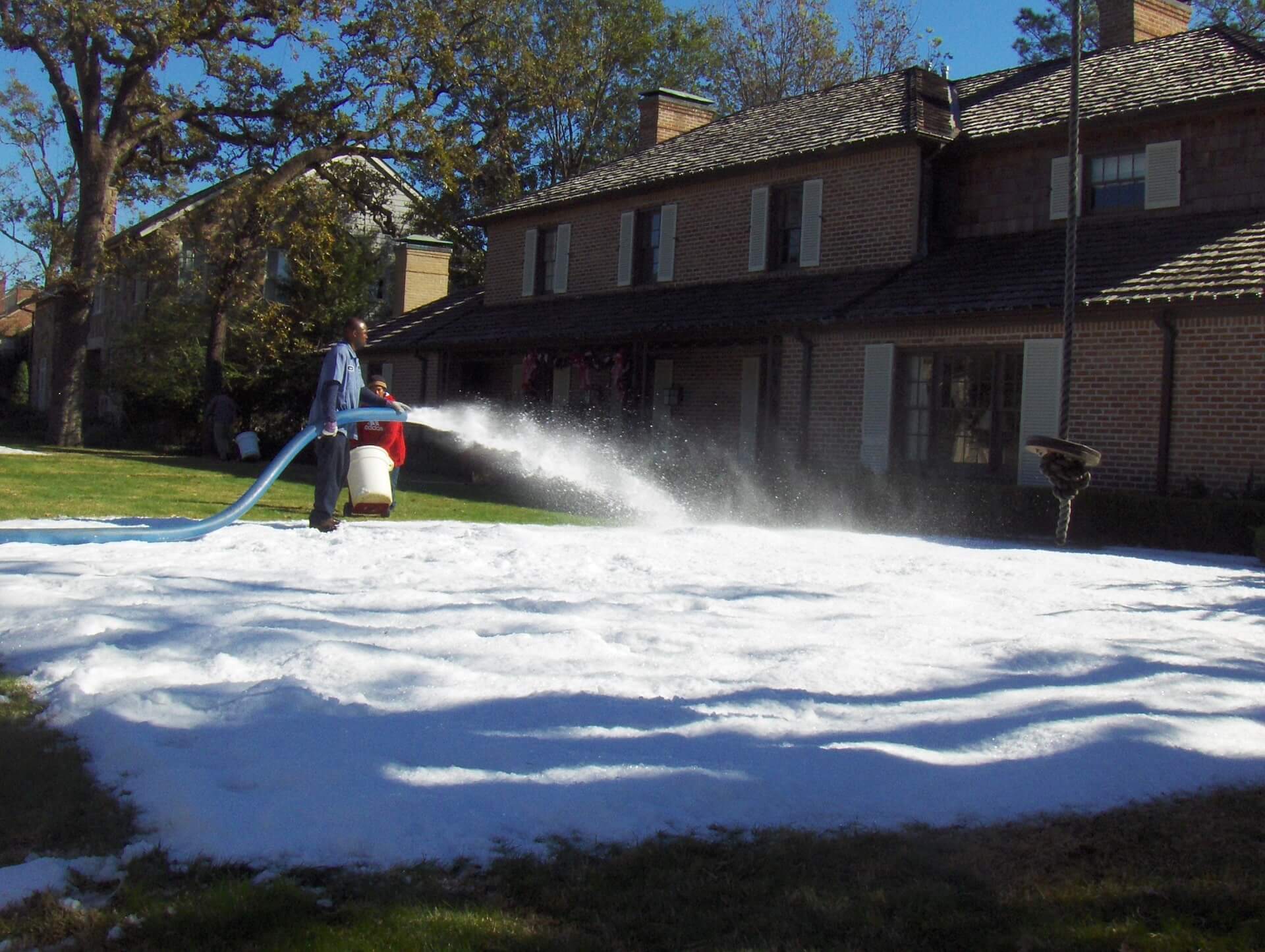 making-snow-in-houston-home-front-yard